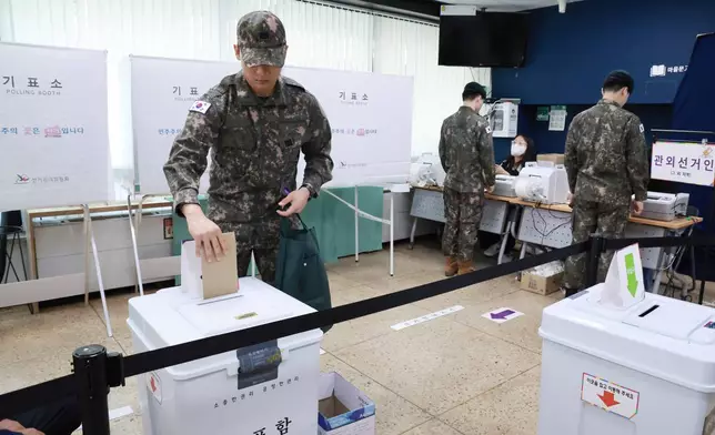 A South Korean army soldier casts his early vote for the June 3 presidential election at a polling station in Seoul, South Korea, Thursday, May 29, 2025. (Hong Hae-in/Yonhap via AP)