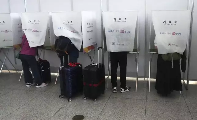 Voters cast their early votes for the June 3 presidential election at a polling station at the departure hall of Incheon International Airport in Incheon, South Korea, Thursday, May 29, 2025. (AP Photo/Lee Jin-man)