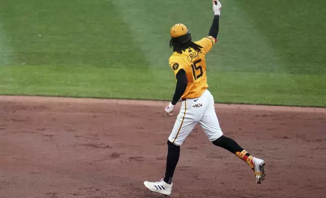 Pittsburgh Pirates' Oneil Cruz rounds the bases after hitting a solo home run off Milwaukee Brewers pitcher Freddy Peralta during the third inning of a baseball game in Pittsburgh, Friday, May 23, 2025. (AP Photo/Gene J. Puskar)