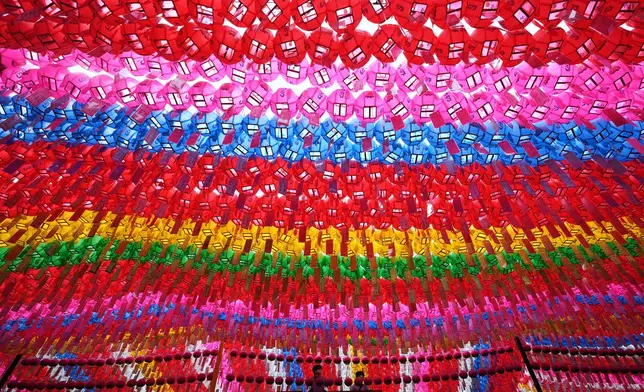 Workers prepare to attach a name tag of a Buddhist who made donation to a lantern for the celebration of Buddha's birthday at the Jogye temple in Seoul, South Korea, Monday, May 5, 2025. (AP Photo/Lee Jin-man)