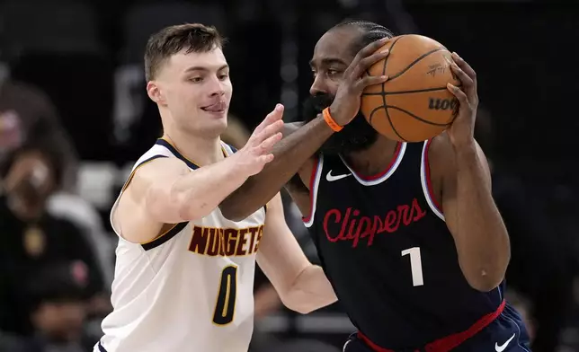 Los Angeles Clippers guard James Harden, right, tries to pass while under pressure from Denver Nuggets guard Christian Braun during the second half in Game 6 of an NBA basketball first-round playoff series Thursday, May 1, 2025, in Inglewood, Calif. (AP Photo/Mark J. Terrill)