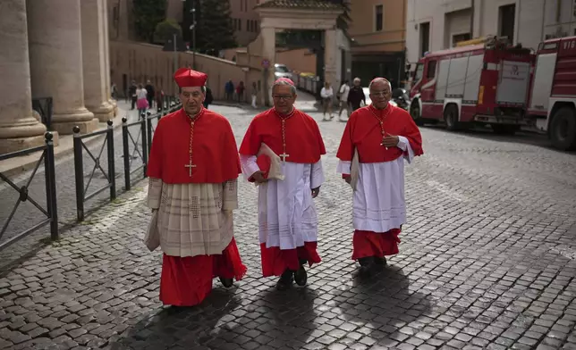 From right, Cardinals Gregorio Rosa Chavez, Luis Jose Rueda Aparicio and Ruben Salazar Gomez arrive to the Vatican, Friday, May 9, 2025, a day after Pope Leo XIV was elected history's first North American pope. (AP Photo/Francisco Seco)