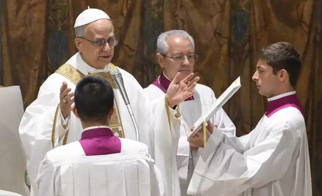 Newly elected Pope Leo XIV concelebrates Mass with the College of Cardinals inside the Sistine Chapel at the Vatican the day after his election as 267th pontiff of the Roman Catholic Church, Friday, May 9, 2025. (Vatican Media via AP)