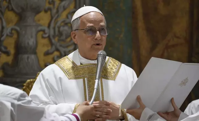 Newly elected Pope Leo XIV concelebrates Mass with the College of Cardinals inside the Sistine Chapel at the Vatican the day after his election as 267th pontiff of the Roman Catholic Church, Friday, May 9, 2025. (Vatican Media via AP)