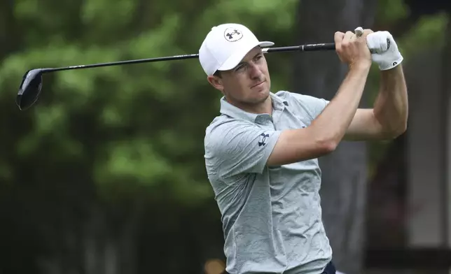 Jordan Spieth follows through on his shot off the sixth tee during the first round of the CJ Cup Byron Nelson golf tournament in McKinney, Texas, Thursday, May 1, 2025. (AP Photo/Gareth Patterson)