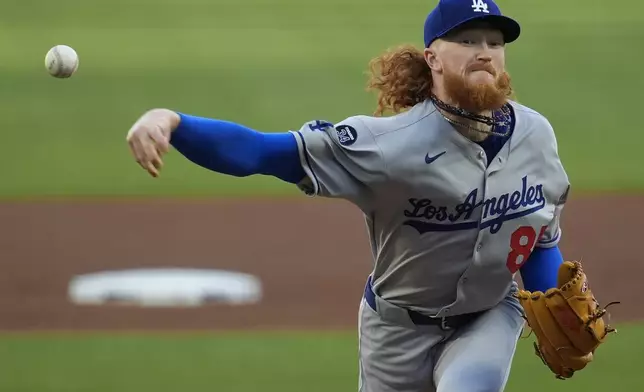 Los Angeles Dodgers pitcher Dustin May (85) works against the Atlanta Braves in the first inning of a baseball game, Sunday, May 4, 2025, in Atlanta. (AP Photo/Mike Stewart)