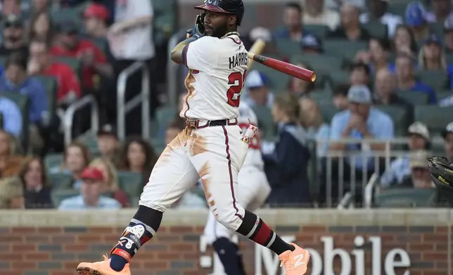 Atlanta Braves outfielder Michael Harris II (23) hits a single against the Los Angeles Dodgers in the third inning of a baseball game, Sunday, May 4, 2025, in Atlanta. (AP Photo/Mike Stewart)