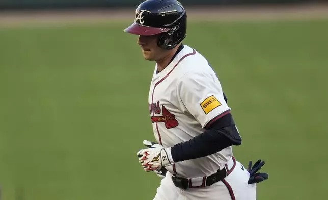 Atlanta Braves third baseman Austin Riley (27) runs the bases after hitting a two-run homer against the Los Angeles Dodgers in the first inning of a baseball game, Sunday, May 4, 2025, in Atlanta. (AP Photo/Mike Stewart)