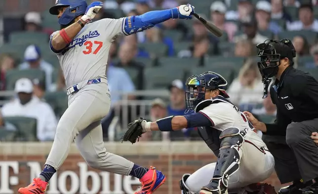 Los Angeles Dodgers outfielder Teoscar Hernández (37) hits a single against the Atlanta Braves in the third inning of a baseball game, Sunday, May 4, 2025, in Atlanta. (AP Photo/Mike Stewart)