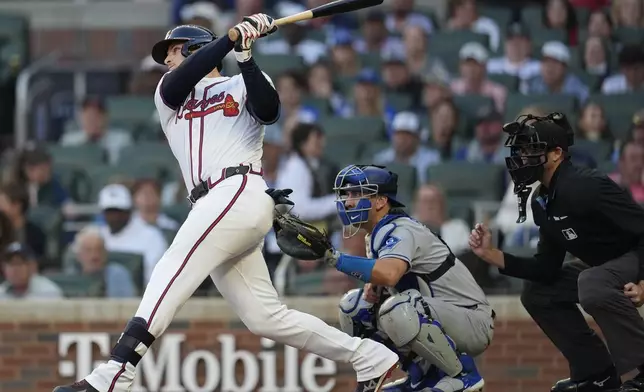 Atlanta Braves' Austin Riley (27) hits a two-run homer against the Los Angeles Dodgers in the third inning of a baseball game, Sunday, May 4, 2025, in Atlanta. (AP Photo/Mike Stewart)