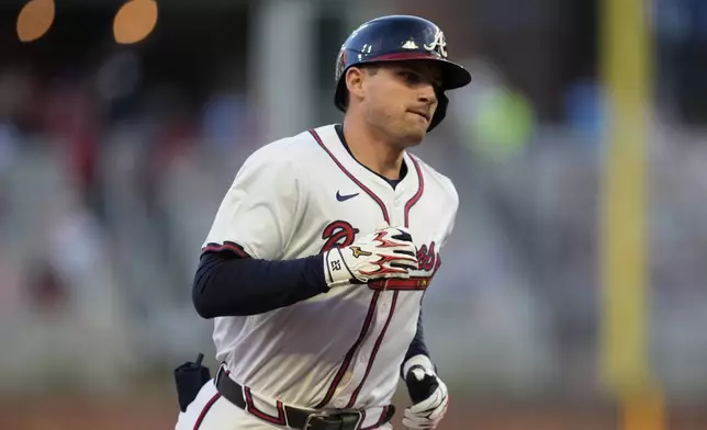 Atlanta Braves' Austin Riley (27) rounds the bases after hitting a two-run homer against the Los Angeles Dodgers in the third inning of a baseball game, Sunday, May 4, 2025, in Atlanta. (AP Photo/Mike Stewart)