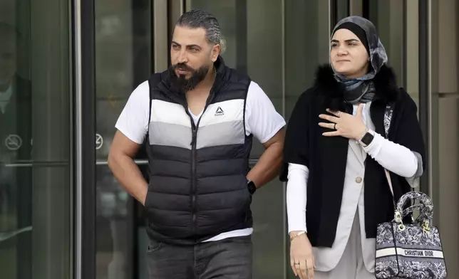 Odai Al Fayoumi, left, father of Wadee Al Fayoumi, who was murdered by Joseph Czuba in 2023, walks out of the Will County Courthouse after the sentencing of Czuba in Joliet, Ill., Friday, May 2, 2025. (Pat Nabong /Chicago Sun-Times via AP)