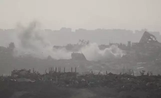 Smoke rises following an Israeli army bombardment in the Gaza Strip, seen from southern Israel, Sunday, May 18, 2025. (AP Photo/Ariel Schalit)