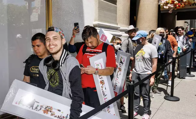 In this photo provided by Nintendo of America, fans waited outside of Nintendo SAN FRANCISCO to celebrate the grand opening in San Francisco’s historic Union Square, where residents and visitors from near and far can experience the world of Nintendo.
