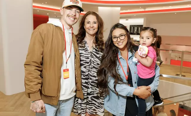 In this photo provided by Nintendo of America, Christian Koss from the San Francisco Giants and family visits Nintendo SAN FRANCISCO store in iconic Union Square.