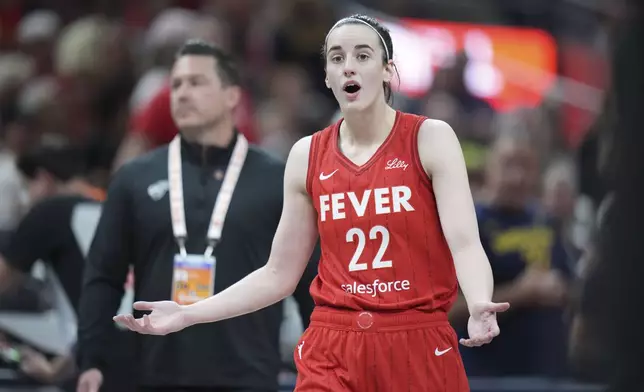 Indiana Fever guard Caitlin Clark (22) reacts after being called for a flagrant foul on Chicago Sky forward Angel Reese during the second half an WNBA basketball game in Indianapolis, Saturday, May 17, 2025. (AP Photo/AJ Mast)