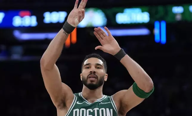 Boston Celtics' Jayson Tatum reacts after scoring a 3-point basket during the second half of Game 3 of an NBA basketball second-round playoff series against the New York Knicks, Saturday, May 10, 2025, in New York. (AP Photo/Pamela Smith)
