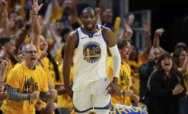 Golden State Warriors forward Jonathan Kuminga reacts after making a 3-point basket during the second half of Game 3 of an NBA basketball second-round playoff series against the Minnesota Timberwolves, Saturday, May 10, 2025, in San Francisco. (AP Photo/Godofredo A. Vásquez)