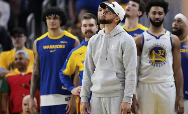 Golden State Warriors' Stephen Curry looks up at the scoreboard during the second half of Game 3 of an NBA basketball second-round playoff series against the Minnesota Timberwolves, Saturday, May 10, 2025, in San Francisco. (AP Photo/Godofredo A. Vásquez)