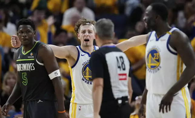 Golden State Warriors guard Brandin Podziemski, center, reacts during the second half of Game 3 of an NBA basketball second-round playoff series against the Minnesota Timberwolves, Saturday, May 10, 2025, in San Francisco. (AP Photo/Godofredo A. Vásquez)