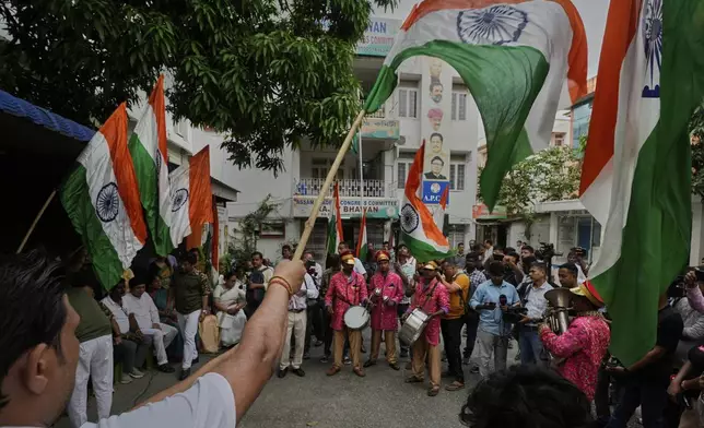 Indian National Congress workers hold Indian national flags in support of the Indian Army as they celebrate the success of 'Operation Sindoor', strike against Pakistan, in Guwahati, India, Friday, May 9, 2025. (AP Photo/Anupam Nath)