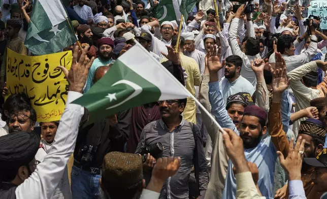 Supporters of a religious group 'Tahafuz-e-Namoos-e-Risalat Mahaz' take part in a rally to condemn Indian strikes in Pakistan and to show their support with Pakistan Army, in Lahore, Pakistan, Saturday, May 10, 2025. (AP Photo/K.M. Chaudary)