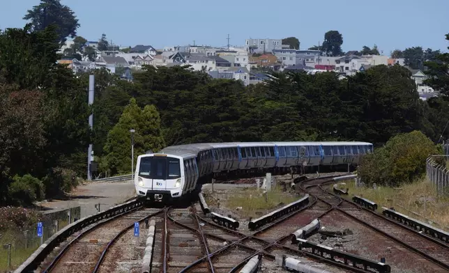 A Bay Area Rapid Transit train approaches a BART station in Daly City, Calif., Friday, May 9, 2025. (AP Photo/Jeff Chiu)