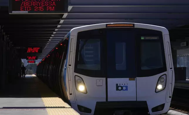A Bay Area Rapid Transit train waits to depart a BART station in Daly City, Calif., Friday, May 9, 2025. (AP Photo/Jeff Chiu)