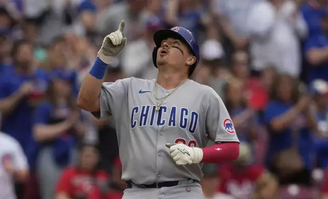 Chicago Cubs' Reese McGuire celebrates after hitting a solo home run in the eighth inning of a baseball game against the Cincinnati Reds, Sunday, May 25, 2025, in Cincinnati. (AP Photo/Carolyn Kaster)