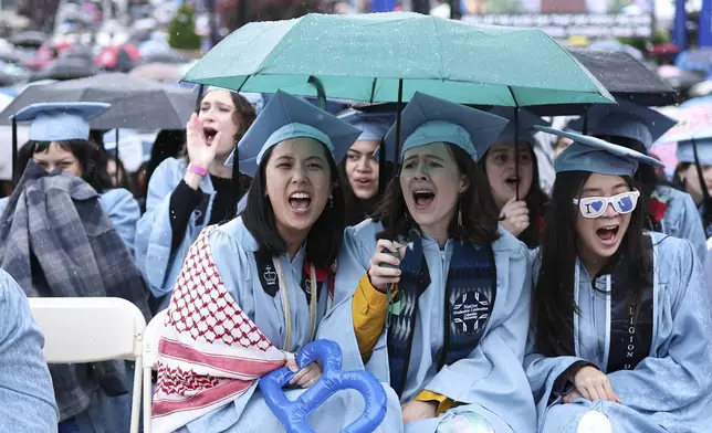 Students react as Columbia University President Claire Shipman speaks during the Columbia University commencement ceremony on Columbia's main campus, in Manhattan, on Wednesday, May 21, 2025 in New York. (Charly Triballeau/Pool Photo via AP)