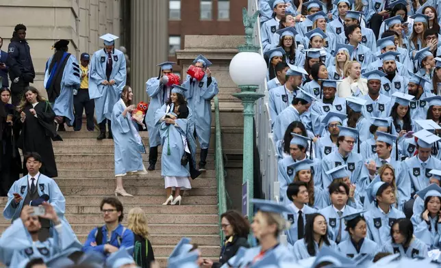 Students gather, on the day of Columbia University commencement ceremony on Columbia's main campus, in Manhattan, on Wednesday, May 21, 2025 in New York. (Jeenah Moon/Pool Photo via AP)