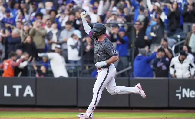 New York Mets' Pete Alonso reacts after hitting a two-run home run during the first inning of a baseball game against the Los Angeles Dodgers, Sunday, May 25, 2025, in New York. (AP Photo/Seth Wenig)