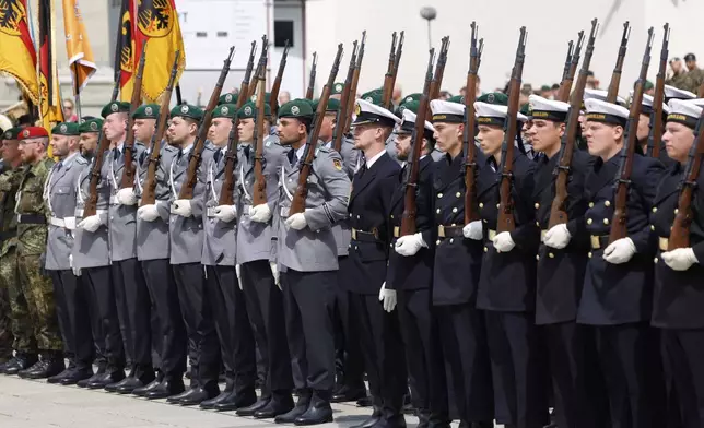 German soldiers march at the formal inauguration of a German brigade for NATO's eastern flank in the center of Vilnius, Lithuania, Thursday, May 22, 2025. (AP Photo/Mindaugas Kulbis)