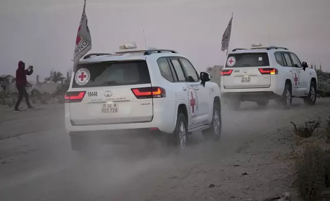 Red Cross vehicles carrying American-Israeli hostage and soldier Edan Alexander leave the Gaza Strip after he was handed over to the organization, Monday, May 12, 2025. (AP Photo/Abdel Kareem Hana)