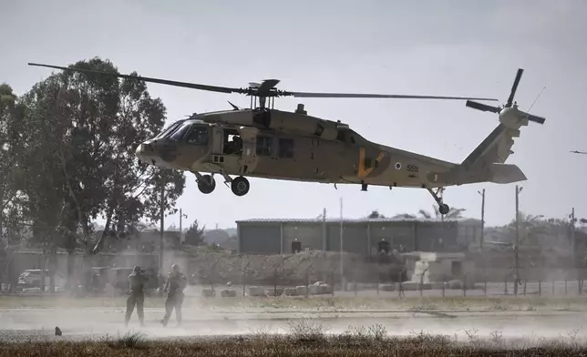 A military helicopter carrying relatives of Israeli-American soldier Edan Alexander lands ahead of his scheduled release from Hamas captivity in Gaza, in Reim, near the Gaza border, southern Israel, Monday, May 12, 2025.(AP Photo/Maya Alleruzzo)