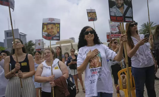 Israelis gather to watch a live broadcast in Tel Aviv's Hostages Square of Israeli-American soldier Edan Alexander being released from Hamas captivity in Gaza, in Tel Aviv, Monday, May 12, 2025. Alexander was abducted during the Hamas-led attack on his base on October 7, 2023. (AP Photo/Oded Balilty)