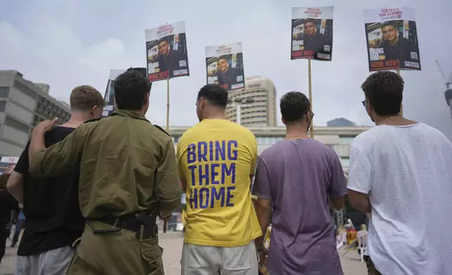Israelis gather to watch a live broadcast of Israeli-American soldier Edan Alexander to be released from Hamas captivity in Gaza, at a plaza known as the hostages square in Tel Aviv, Monday, May 12, 2025. Alexander was abducted during the Hamas-led attack on his base on October 7, 2023. (AP Photo/Oded Balilty)