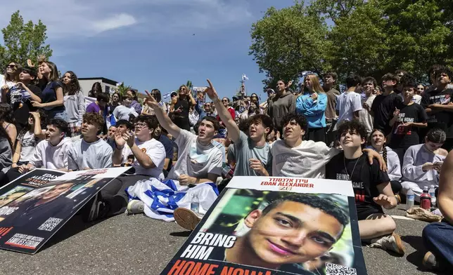 Residents and friends gather in Huyler Park ahead of the release of American hostage Edan Alexander from Hamas on Monday, May 12, 2025 in Tenafly, New Jersey. (AP Photo/Stefan Jeremiah)