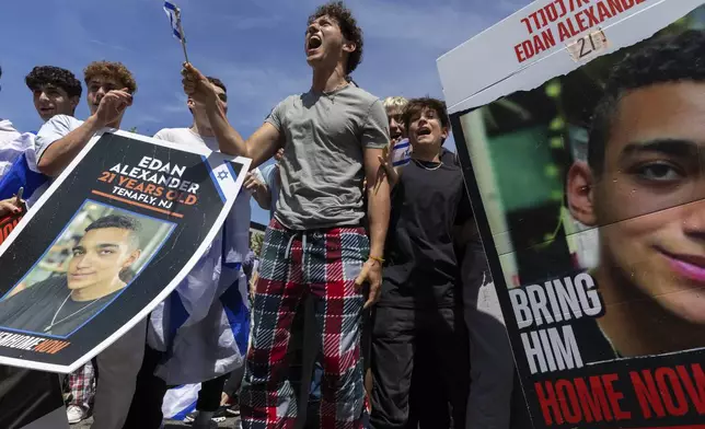 People gathered in Huyler Park celebrate the release of American hostage Edan Alexander from Hamas on Monday, May 12, 2025, in Tenafly, N.J. (AP Photo/Stefan Jeremiah)