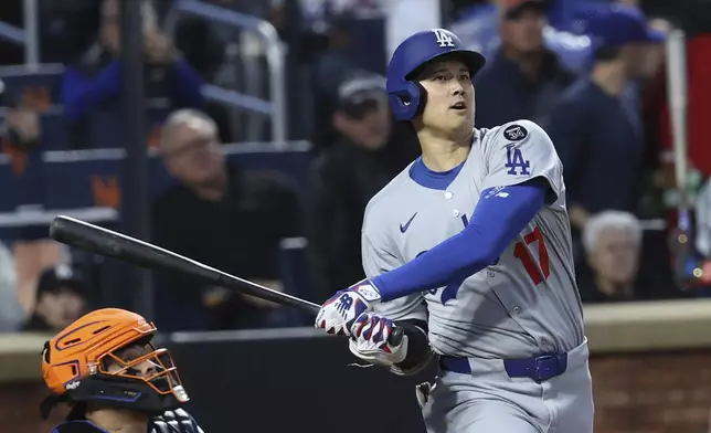 Los Angeles Dodgers' Shohei Ohtani bats during the third inning of a baseball game against the New York Mets, Friday, May 23, 2025, in New York. (AP Photo/Pamela Smith)