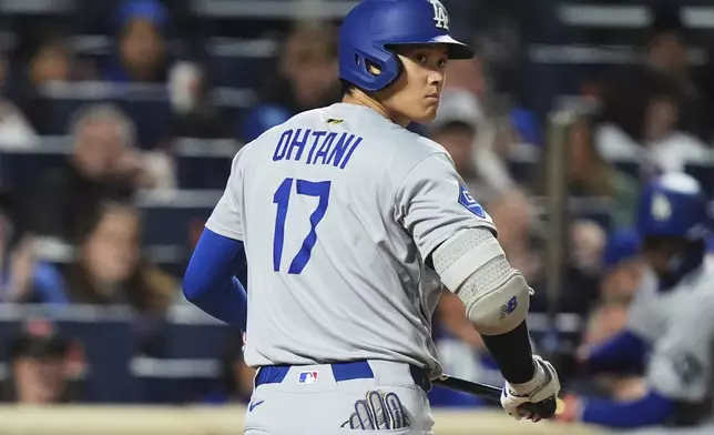 Los Angeles Dodgers' Shohei Ohtani, of Japan, reacts after striking out during the eighth inning of a baseball game against the New York Mets Saturday, May 24, 2025, in New York. (AP Photo/Frank Franklin II)
