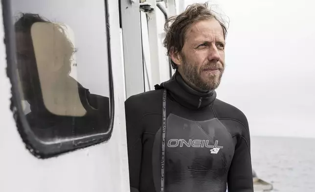 Douglas McCauley, director of the University of California Santa Barbara's Benioff Ocean Science Laboratory, poses for a portrait after returning from snorkeling in Channel Islands, Calif., Thursday, May 1, 2025. (AP Photo/Annika Hammerschlag)