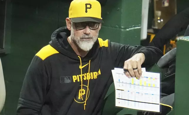 Pittsburgh Pirates manager Derek Shelton stands in the dugout during a baseball game against the San Diego Padres in Pittsburgh, Friday, May 2, 2025. (AP Photo/Gene J. Puskar)