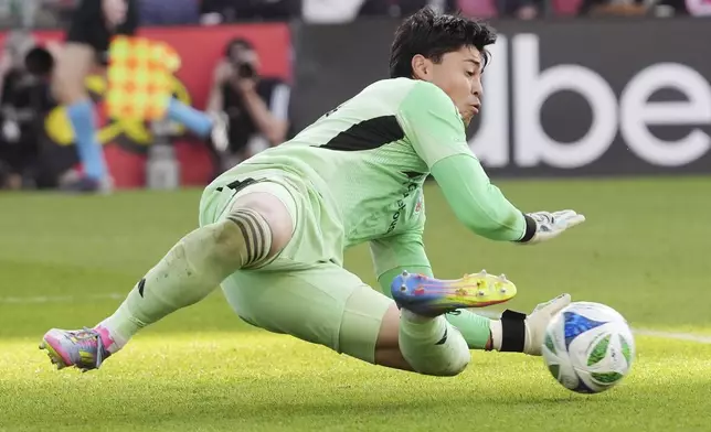 D.C. United goalkeeper Luis Barraza (13) makes a save against Toronto FC during the second half of an MLS soccer game in Toronto, Saturday, May 10, 2025. (Frank Gunn/The Canadian Press via AP)