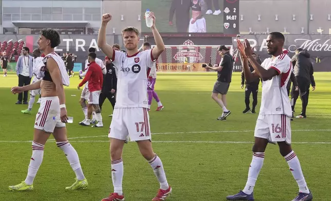 Toronto FC players applaud their fans after defeating D.C. United in an MLS soccer game in Toronto, Saturday, May 10, 2025. (Frank Gunn/The Canadian Press via AP)