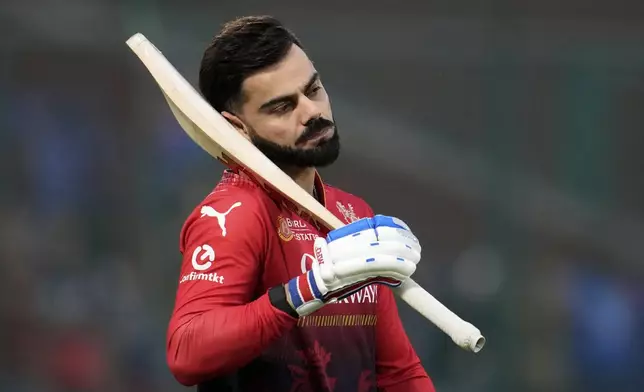 FILE - Royal Challengers Bengaluru's Virat Kohli warms up before the start of the Indian Premier League cricket match between Delhi Capitals and Royal Challengers Bengaluru at Arun Jaitley Stadium in New Delhi, India, on April 27, 2025. (AP Photo/Manish Swarup, File)