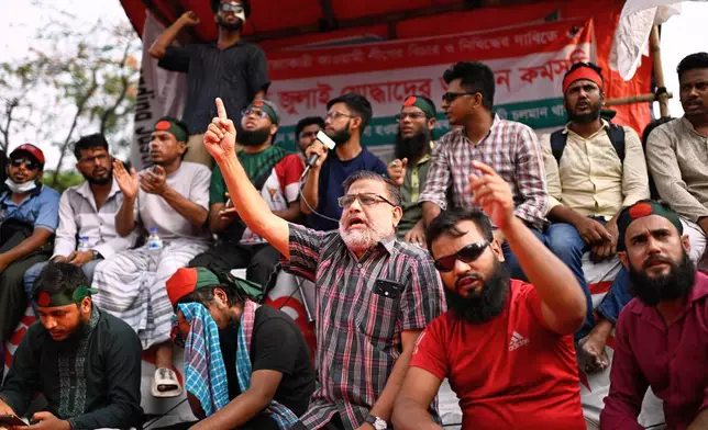 Protesters, some who were injured in protests against former Prime Minister Sheikh Hasina last year, demand a ban on her Awami League party, in Dhaka, Bangladesh, Sunday, May 11, 2025. (AP Photo/Mahmud Hossain Opu)