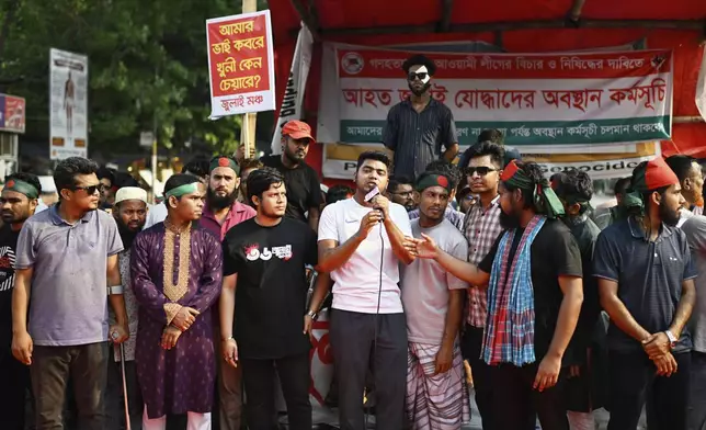 Protesters, some who were injured in protests against former Prime Minister Sheikh Hasina last year, demand a ban on her Awami League party, in Dhaka, Bangladesh, Sunday, May 11, 2025. (AP Photo/Mahmud Hossain Opu)