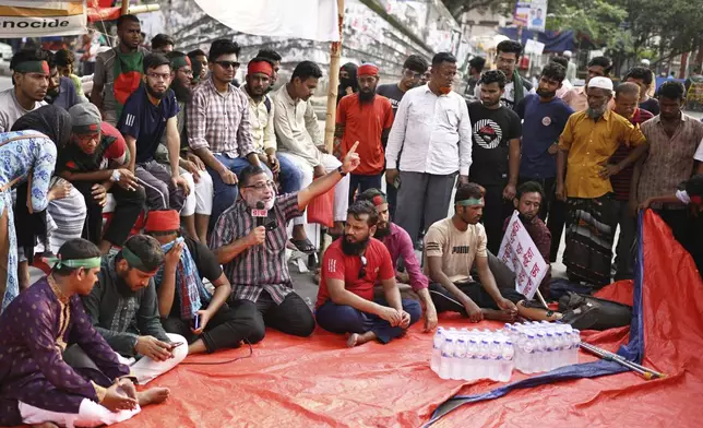 Protesters, some who were injured in protests against former Prime Minister Sheikh Hasina last year, demand a ban on her Awami League party, in Dhaka, Bangladesh, Sunday, May 11, 2025. (AP Photo/Mahmud Hossain Opu)