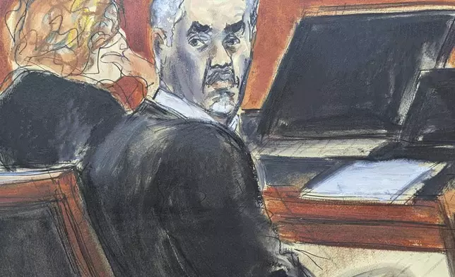 Sean 'Diddy' Combs, right, turns around and looks at the audience during jury selection at Manhattan federal court, Monday, May 5, 2025, in New York. (Elizabeth Williams via AP)